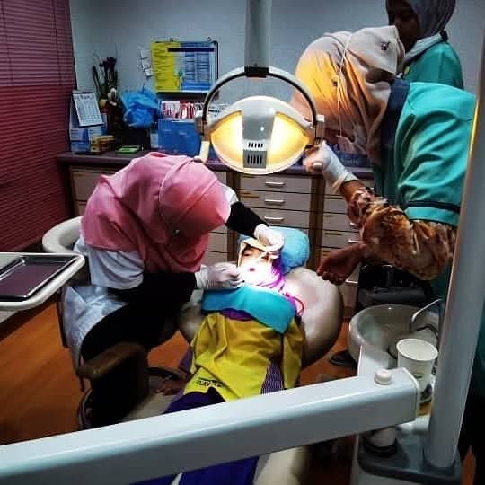Treating a child in the surgery